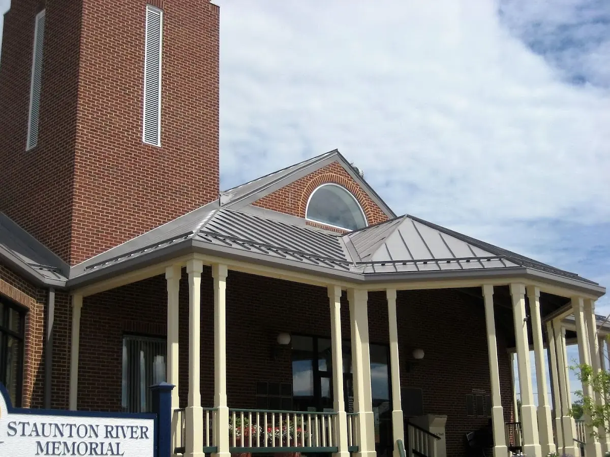 Skilled roofing craftsmen working on a residential roof in Bruceville